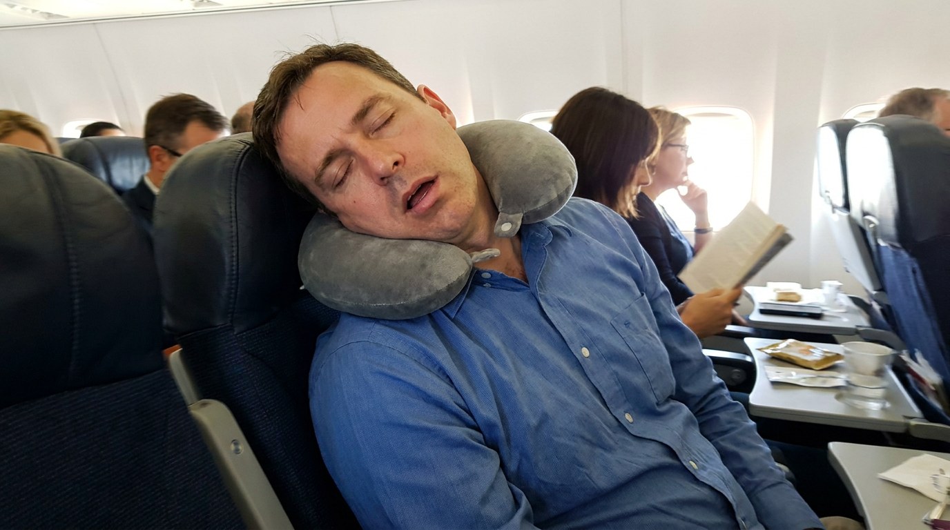 Tired passenger whose head has flopped to the side